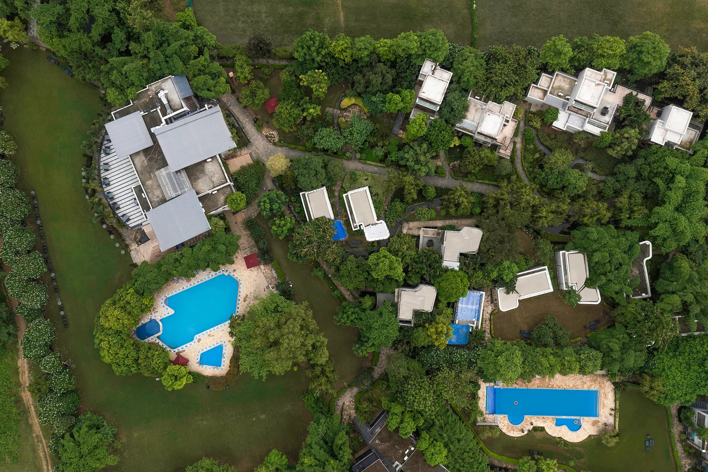 Drone View of Luxury Resort Layout, Villas, and Multiple Pools